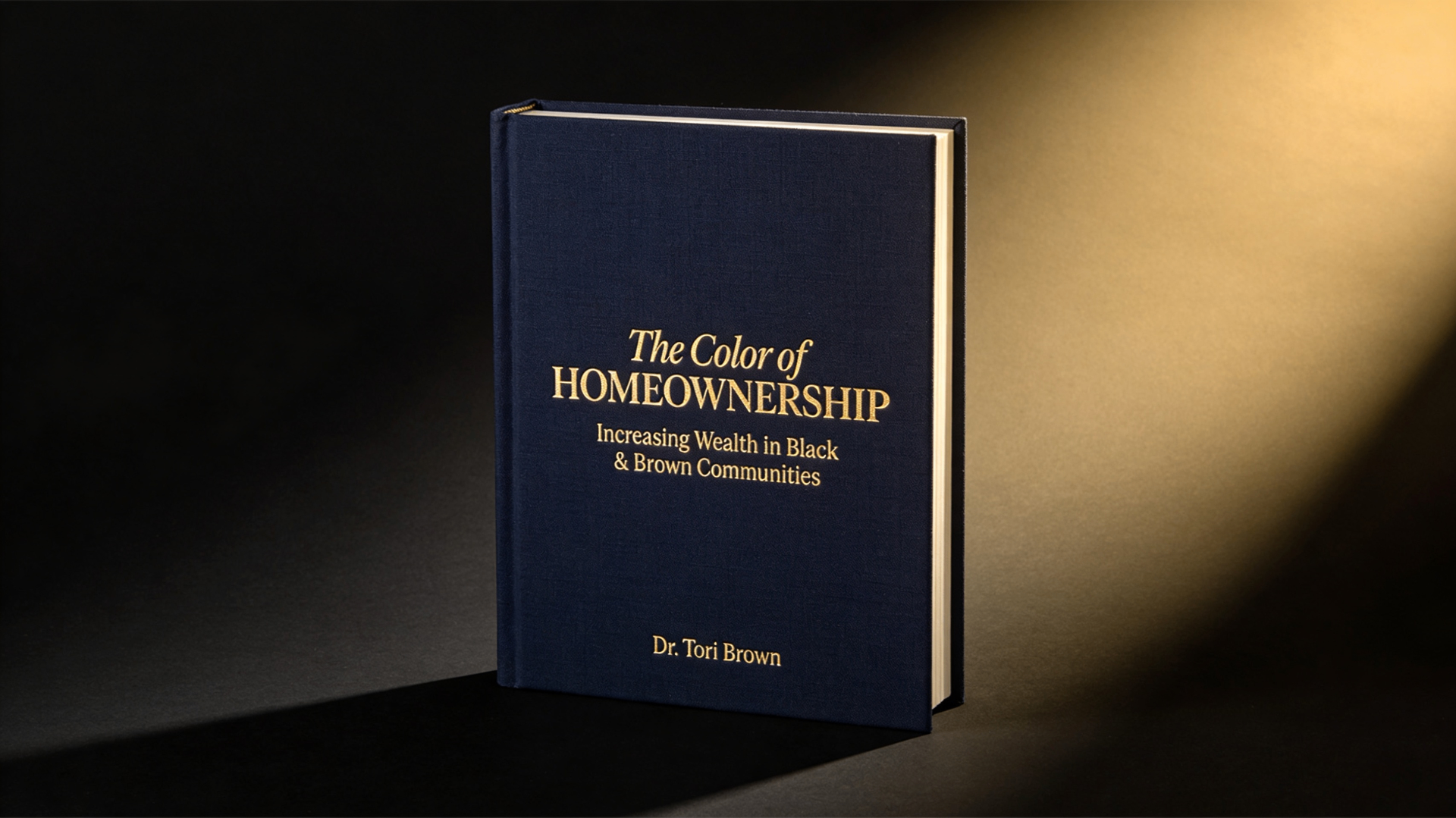 The Color of Homeownership: Increasing Wealth in Black & Brown Communities by Dr. Tori Brown — navy hardcover with gold foil
